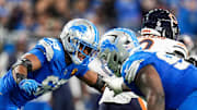 The Detroit Lions get after Chicago Bears quarterback Caleb Williams.