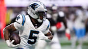 Nov 16, 2025; Atlanta, Georgia, USA; Carolina Panthers running back Rico Dowdle (5) runs with the ball in the third quarter against the Carolina Panthers at Mercedes-Benz Stadium. 