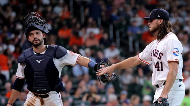 Houston Astros catcher Cesar Salazar (18) and starting pitcher Spencer Arrighetti (41) greet each other after retiring the side against the Colorado Rockies during the sixth inning at Minute Maid Park on June 26.