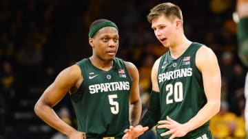 Jan 24, 2019; Iowa City, IA, USA; Michigan State Spartans guard Matt McQuaid (20) and guard Cassius Winston (5) talk during the second half against the Iowa Hawkeyes at Carver-Hawkeye Arena. Mandatory Credit: Jeffrey Becker-USA TODAY Sports