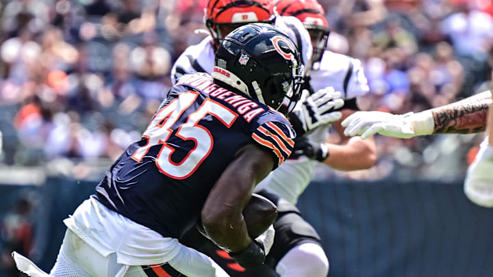 Aug 17, 2024; Chicago, Illinois, USA; Chicago Bears linebacker Amen Ogbongbemiga (45) returns an intercepted pass against the Cincinnati Bengals during the second quarter at Soldier Field. Mandatory Credit: Daniel Bartel-Imagn Images