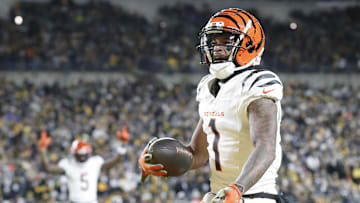 Jan 4, 2025; Pittsburgh, Pennsylvania, USA;  Cincinnati Bengals wide receiver Ja'Marr Chase (1) reacts after catching a touchdown pass against the Pittsburgh Steelers  during the first quarter at Acrisure Stadium. Mandatory Credit: Charles LeClaire-Imagn Images