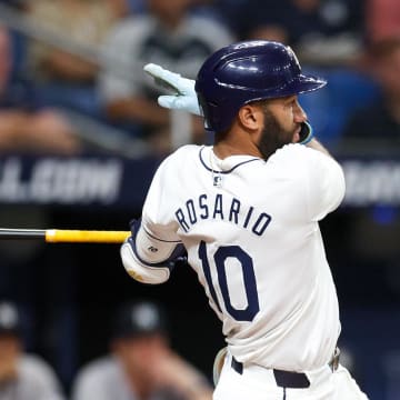 Tampa Bay Rays second baseman Amed Rosario (10) hits an rbi double against the New York Yankees in the second inning  at Tropicana Field.