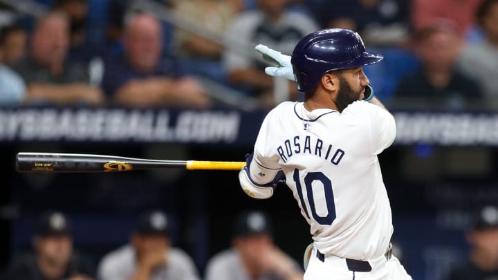 Tampa Bay Rays second baseman Amed Rosario (10) hits an rbi double against the New York Yankees in the second inning  at Tropicana Field.