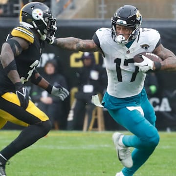 Oct 29, 2023; Pittsburgh, Pennsylvania, USA;  Jacksonville Jaguars tight end Evan Engram (17) against Pittsburgh Steelers safety Keanu Neal (31)  during the fourth quarter at Acrisure Stadium. Jacksonville won 20-10. 