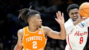 Tennessee Volunteers guard Chaz Lanier (2) guards Houston Cougars guard Mylik Wilson (8) as he passes the ball during the second half of a game Sunday, March 30, 2025, during the Elite Eight round of the NCAA March Madness tournament at Lucas Oil Stadium in Indianapolis. Houston defeated Tennessee 69-50.