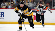Jan 11, 2025; Pittsburgh, Pennsylvania, USA;  Pittsburgh Penguins defenseman Owen Pickering (38) skates up ice with the puck against the Ottawa Senators during the third period at PPG Paints Arena. Mandatory Credit: Charles LeClaire-Imagn Images