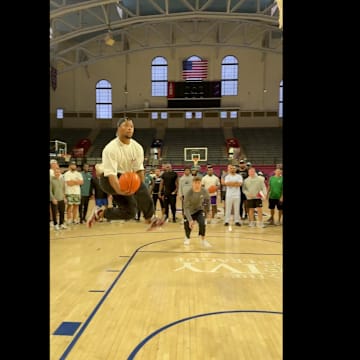 Saquon Barkley and Cooper DeJean going for an alley-oop during an Eagles outing on May 23, 2025.