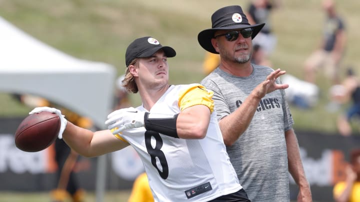 Jul 27, 2023; Latrobe, PA, USA;  Pittsburgh Steelers quarterback Kenny Pickett (8) passes the ball as offensive coordinator Matt Canada (right) instructs in drills during training camp at Saint Vincent College. Mandatory Credit: Charles LeClaire-USA TODAY Sports