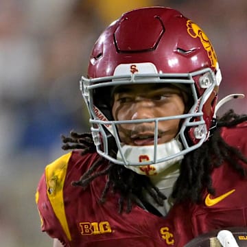 Oct 11, 2025; Los Angeles, California, USA; USC Trojans wide receiver Makai Lemon (6) takes the ball on a kickoff return in the second half against the Michigan Wolverines at United Airlines Field at the Los Angeles Memorial Coliseum. Mandatory Credit: Jayne Kamin-Oncea-Imagn Images