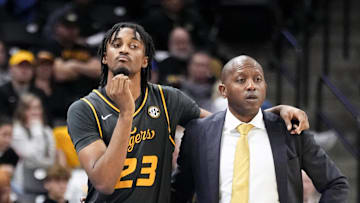 Dec 14, 2024; Columbia, Missouri, USA; Missouri Tigers guard Aidan Shaw (23) stands with head coach Dennis Gates while waiting to go in against the LIU Sharks during the second half at Mizzou Arena. Mandatory Credit: Denny Medley-Imagn Images