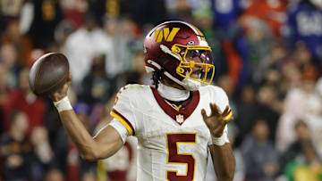 Nov 2, 2025; Landover, Maryland, USA; Washington Commanders quarterback Jayden Daniels (5) passes the ball during the second half against the Seattle Seahawks at Northwest Stadium. Mandatory Credit: Amber Searls-Imagn Images