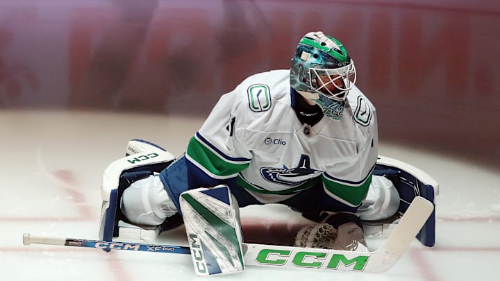 Vancouver Canucks goaltender Arturs Silovs (31) stretches on the ice to warm up against the Pittsburgh Penguins at PPG Paints Arena.