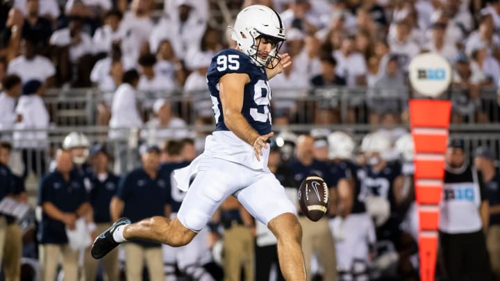 Penn State's Riley Thompson punts the ball away during a football game against West Virginia at Beaver Stadium.