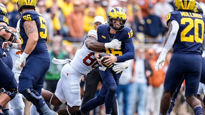 Michigan quarterback Davis Warren (16) is sacked by Texas linebacker Barryn Sorrell (88) during the second half at Michigan Stadium in Ann Arbor on Saturday, September 7, 2024.