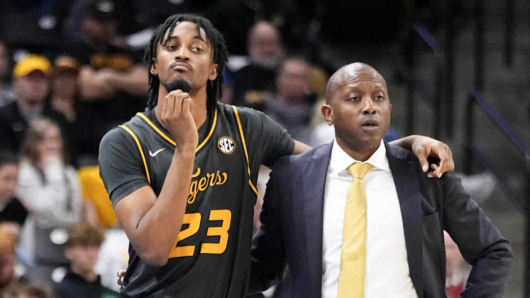 Dec 14, 2024; Columbia, Missouri, USA; Missouri Tigers guard Aidan Shaw (23) stands with head coach Dennis Gates while waiting to go in against the LIU Sharks during the second half at Mizzou Arena. Mandatory Credit: Denny Medley-Imagn Images