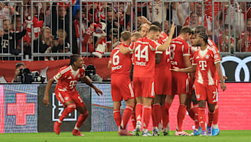 Bayern Munich players celebrating a goal against RB Leipzig on matchday one of the Bundesliga.