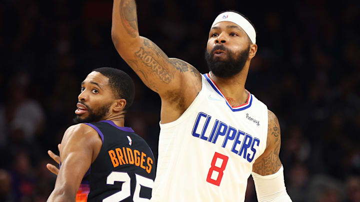 Jan 6, 2022; Phoenix, Arizona, USA; Los Angeles Clippers forward Marcus Morris Sr. (8) against Phoenix Suns forward Mikal Bridges (25) at Footprint Center. Mandatory Credit: Mark J. Rebilas-Imagn Images