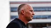 Aug 28, 2025; Raleigh, North Carolina, USA; North Carolina State Wolfpack head coach Dave Doeren looks on during the warmups prior to the game against East Carolina Pirates at Carter-Finley Stadium. Mandatory Credit: Jaylynn Nash-Imagn Images