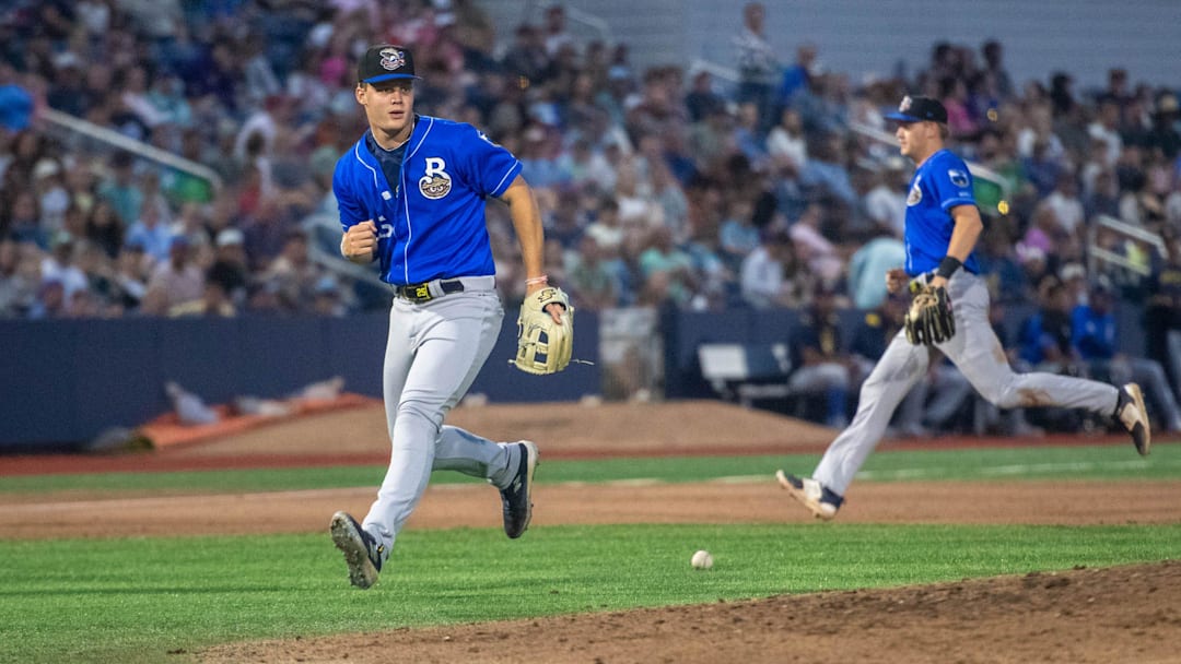The Blue Wahoos load the bases as Biloxi Shuckers third baseman Brock Wilken (25) can't find the handle on a soft grounder during the opening night of the baseball season in Pensacola on Friday, April 4, 2025.