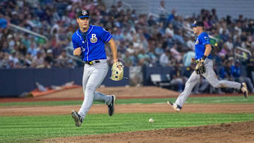The Blue Wahoos load the bases as Biloxi Shuckers third baseman Brock Wilken (25) can't find the handle on a soft grounder during the opening night of the baseball season in Pensacola on Friday, April 4, 2025.