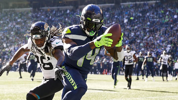 Oct 31, 2021; Seattle, Washington, USA; Seattle Seahawks wide receiver DK Metcalf (14) catches a touchdown pass against Jacksonville Jaguars cornerback Shaquill Griffin (26) during the second quarter at Lumen Field. Mandatory Credit: Joe Nicholson-Imagn Images Oct 31, 2021; Seattle, Washington, USA; Seattle Seahawks wide receiver DK Metcalf (14) catches a touchdown pass against Jacksonville Jaguars cornerback Shaquill Griffin (26) during the second quarter at Lumen Field. Mandatory Credit: Joe Nicholson-Imagn Images