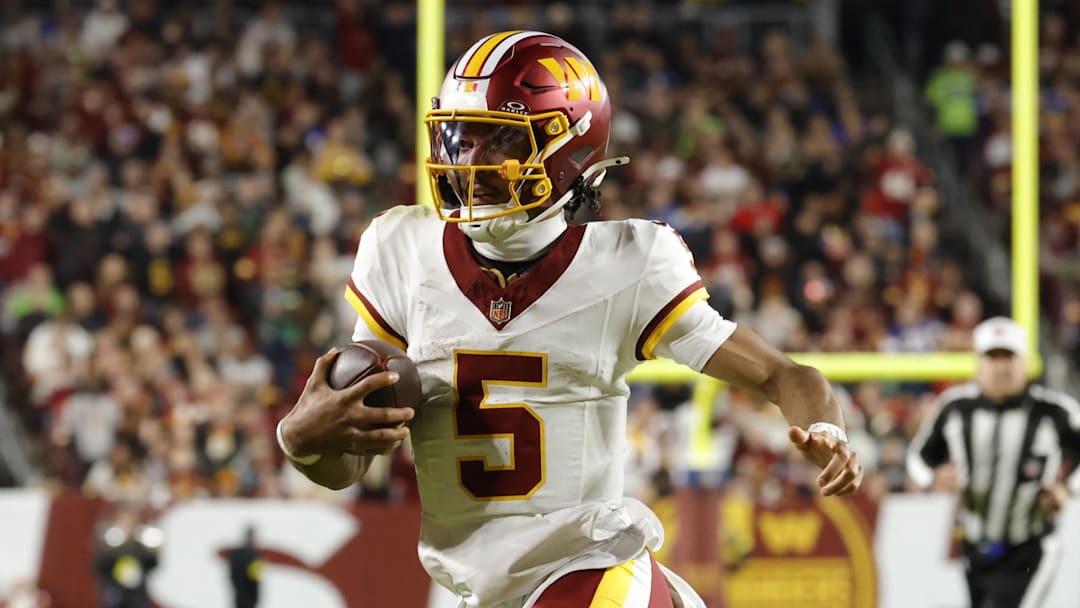 Nov 2, 2025; Landover, Maryland, USA; Washington Commanders quarterback Jayden Daniels (5) runs the ball against the Seattle Seahawks during the first half at Northwest Stadium. Mandatory Credit: Amber Searls-Imagn Images