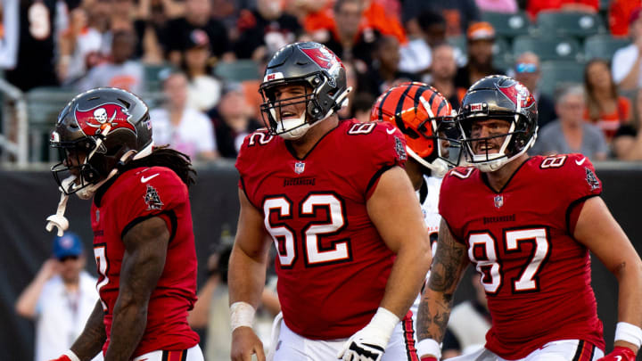 Tampa Bay Buccaneers running back Bucky Irving (7) and Tampa Bay Buccaneers center Graham Barton (62) react after he scored a touchdown in the second quarter of the NFL preseason game against the Cincinnati Bengals at Paycor Stadium in Cincinnati on Saturday, August 10, 2024.