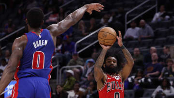 Apr 11, 2024; Detroit, Michigan, USA;  Chicago Bulls guard Coby White (0) shoots on Detroit Pistons center Jalen Duren (0) in the second half at Little Caesars Arena. Mandatory Credit: Rick Osentoski-USA TODAY Sports