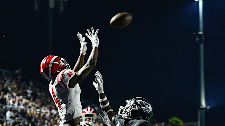 Mater Dei Monarchs wide receiver makes a leaping catch for a touchdown over St. John Bosco Braves