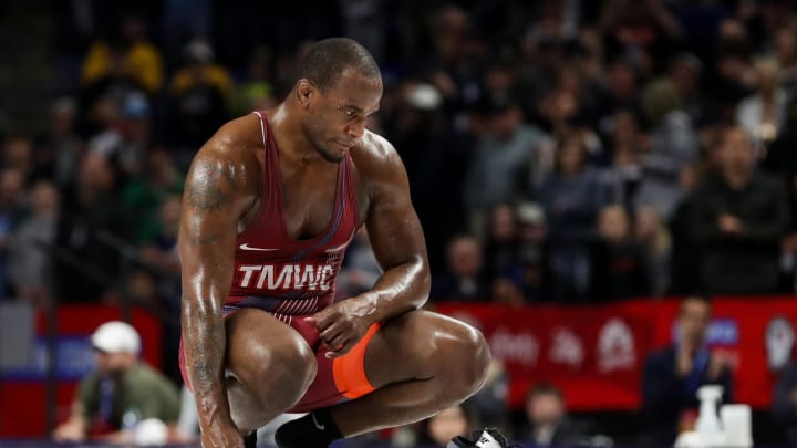 Apr 19, 2024; State College, Pennsylvania, USA; J'den Cox looks on after removing his wrestling shoes on the mat after falling by decision 2-2 to Kollin Moore (not pictured) in a 97 kilograms semifinals match during the U.S. Olympic Wrestling Team Trials at Bryce Jordan Center at Penn State University. J'den Cox ended his wrestling career on the mat by removing his wrestling shoes and walking off of the competition mat. Mandatory Credit: Matthew O'Haren-USA TODAY Sports