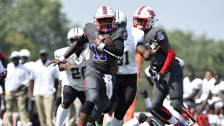 Hyattsville, MD, USA; DeMatha Stags quarterback runs the ball into the end zone Hyattsville, MD, USA; DeMatha Stags quarterback runs the ball into the end zone