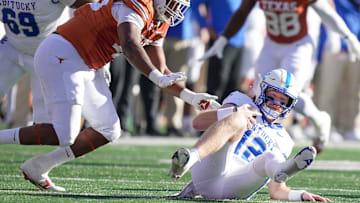 Texas Longhorns defensive lineman Vernon Broughton (45) sacks Kentucky Wildcats quarterback Brock Vandagriff (12) in the first quarter during the first half of an NCAA college football game at Darrell K Royal Texas Memorial Stadium, Austin, Texas, Saturday, Nov 24, 2024.