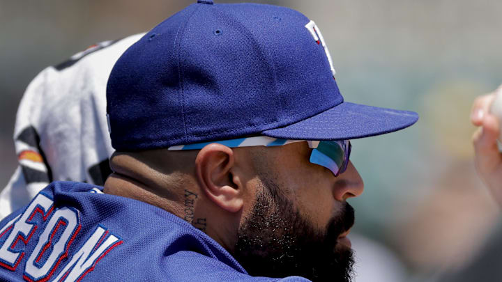 May 31, 2023; Detroit, Michigan, USA; Texas Rangers catcher Sandy Leon (12) watches from the dugout in the second inning against the Detroit Tigers at Comerica Park. Mandatory Credit: Rick Osentoski-Imagn Images