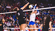 Rebekah Allick slams an overpass for a kill against UCLA. The senior middle blocker finished with 13 kills and seven blocks against the Bruins.