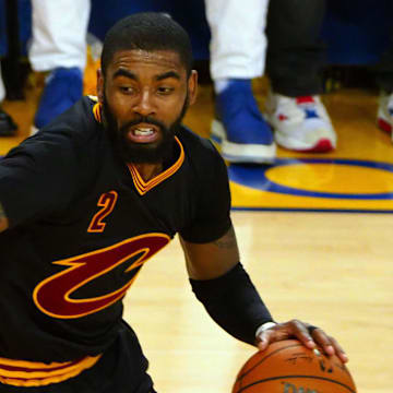 Jun 12, 2017; Oakland, CA, USA; Cleveland Cavaliers guard Kyrie Irving (2) handles the ball against Golden State Warriors guard Stephen Curry (30) during the third quarter in game five of the 2017 NBA Finals at Oracle Arena. Mandatory Credit: Kelley L Cox-Imagn Images