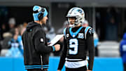 Dec 22, 2024; Charlotte, North Carolina, USA; Carolina Panthers head coach Dave Canales with quarterback Bryce Young (9) in the fourth quarter at Bank of America Stadium. Mandatory Credit: Bob Donnan-Imagn Images