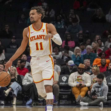 Feb 14, 2024; Charlotte, North Carolina, USA; Atlanta Hawks guard Trae Young (11) handles the ball against the Charlotte Hornets during the first quarter at Spectrum Center. Mandatory Credit: Jim Dedmon-USA TODAY Sports