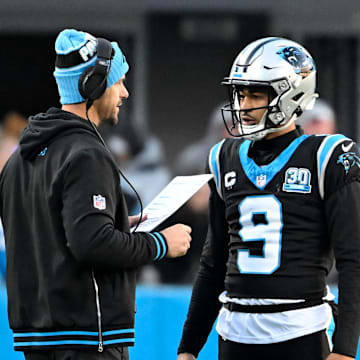Dec 22, 2024; Charlotte, North Carolina, USA; Carolina Panthers head coach Dave Canales with quarterback Bryce Young (9) in the fourth quarter at Bank of America Stadium. Mandatory Credit: Bob Donnan-Imagn Images