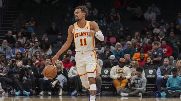 Feb 14, 2024; Charlotte, North Carolina, USA; Atlanta Hawks guard Trae Young (11) handles the ball against the Charlotte Hornets during the first quarter at Spectrum Center. Mandatory Credit: Jim Dedmon-USA TODAY Sports