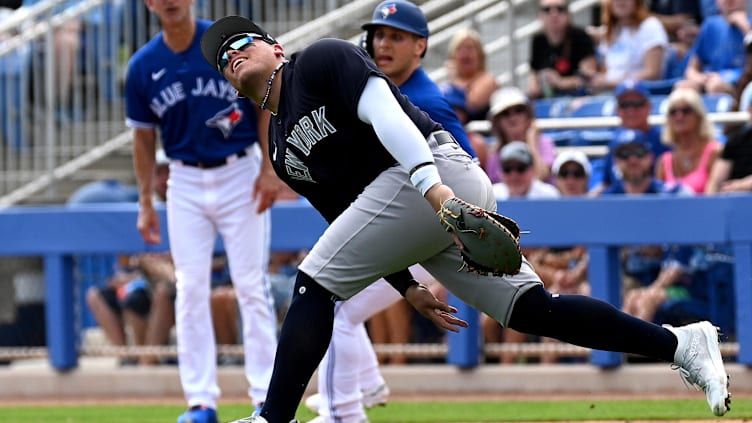 Feb 26, 2023; Dunedin, Florida, USA; New York Yankees first baseman Andres Chaparro (87) attempts to locate a fly ball in the second inning against the Toronto Blue Jays at TD Ballpark. Mandatory Credit: Jonathan Dyer-USA TODAY Sports