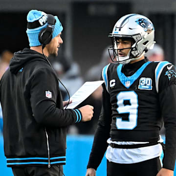 Dec 22, 2024; Charlotte, North Carolina, USA; Carolina Panthers head coach Dave Canales with quarterback Bryce Young (9) in the fourth quarter at Bank of America Stadium. Mandatory Credit: Bob Donnan-Imagn Images
