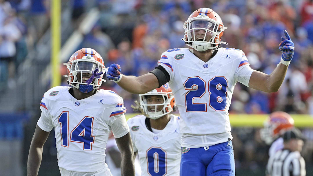 Nov 2, 2024; Jacksonville, Florida, USA; Florida Gators defensive back Devin Moore (28) celebrates after an interception against the Georgia Bulldogs during the first half at EverBank Stadium. Mandatory Credit: Melina Myers-Imagn Images