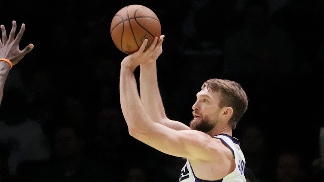 Nov 14, 2025; Minneapolis, Minnesota, USA; Sacramento Kings center Domantas Sabonis (11) shoots against the Minnesota Timberwolves in the first quarter at Target Center. Mandatory Credit: Bruce Kluckhohn-Imagn Images