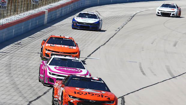 Daniel Suarez leads driver Zane Smith and driver Chase Elliott during the NASCAR Cup Series AutoTrader EchoPark 400.