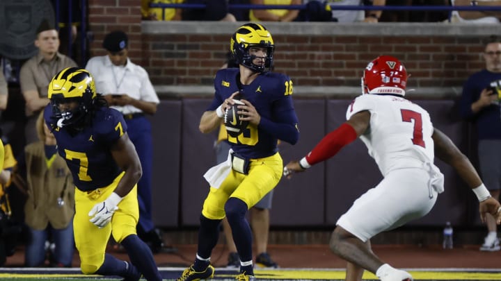 Aug 31, 2024; Ann Arbor, Michigan, USA;  Michigan Wolverines quarterback Davis Warren (16) drops back to pass against the Fresno State Bulldogs in the first half at Michigan Stadium. Mandatory Credit: Rick Osentoski-USA TODAY Sports