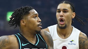 Portland Trail Blazers guard Caleb Love drives against Cleveland Cavaliers guard Jaylon Tyson.