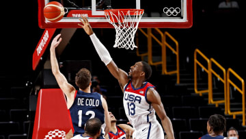 Aug 7, 2021; Saitama, Japan; France shooting guard Nando de Colo (12) shoots the ball against United States center Bam Adebayo (13) in the men's basketball gold medal game during the Tokyo 2020 Olympic Summer Games at Saitama Super Arena. Mandatory Credit: Geoff Burke-USA TODAY Sports