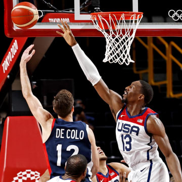 Aug 7, 2021; Saitama, Japan; France shooting guard Nando de Colo (12) shoots the ball against United States center Bam Adebayo (13) in the men's basketball gold medal game during the Tokyo 2020 Olympic Summer Games at Saitama Super Arena. Mandatory Credit: Geoff Burke-USA TODAY Sports