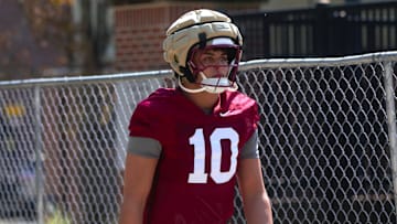 FSU football players walk into the first spring practice of the spring season on Wednesday, March 19, 2025